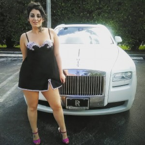 Helga Hardd Poses in Front of White Rolls Royce