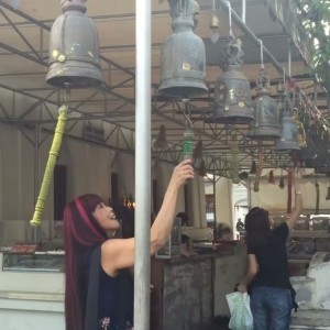 HERE I AM RINGING THE BELL AT THE THAI TEMPLE IN BANGKOK