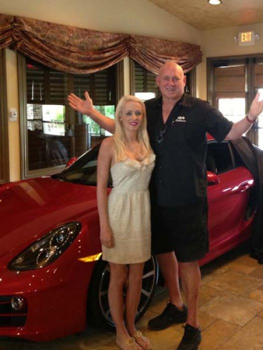 Daddy D and Krissy with a new porsche.jpg